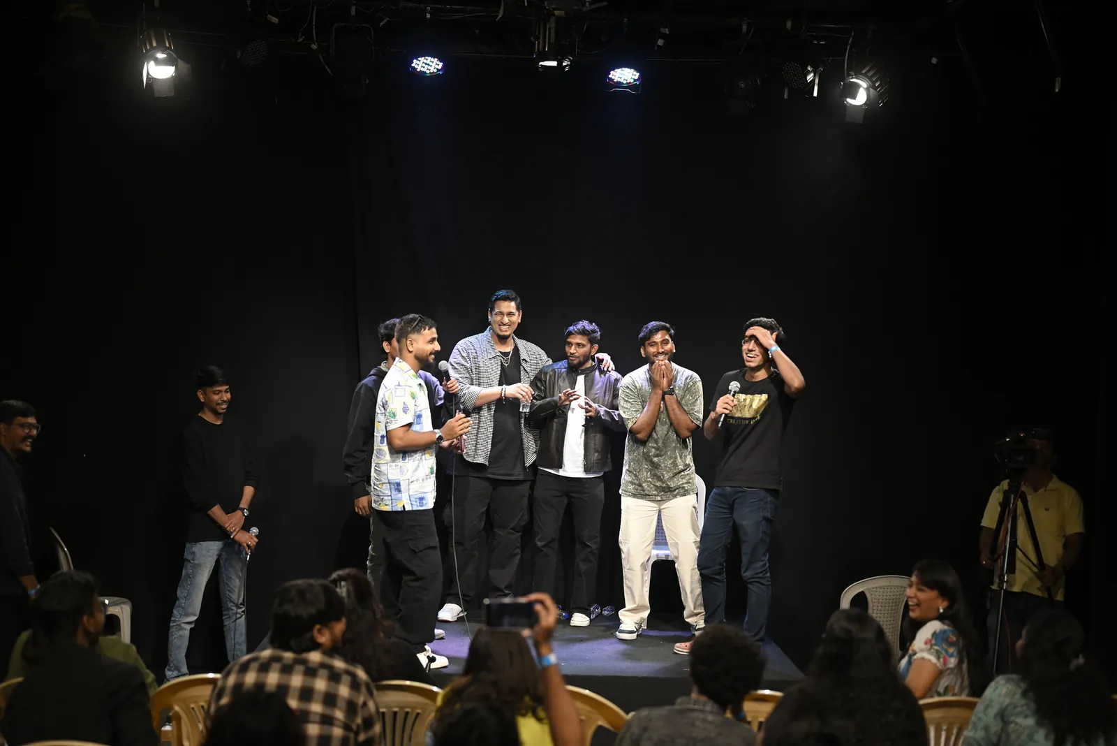 Artists on stage during the open mic segment